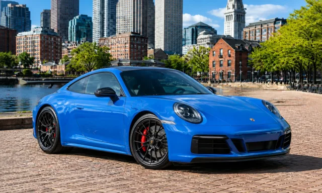 Blue Porsche 911 GTS from the Supreme Rentals exotic fleet in Boston.